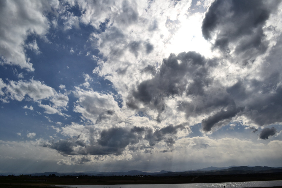 Sun behind clouds, crepuscular rays