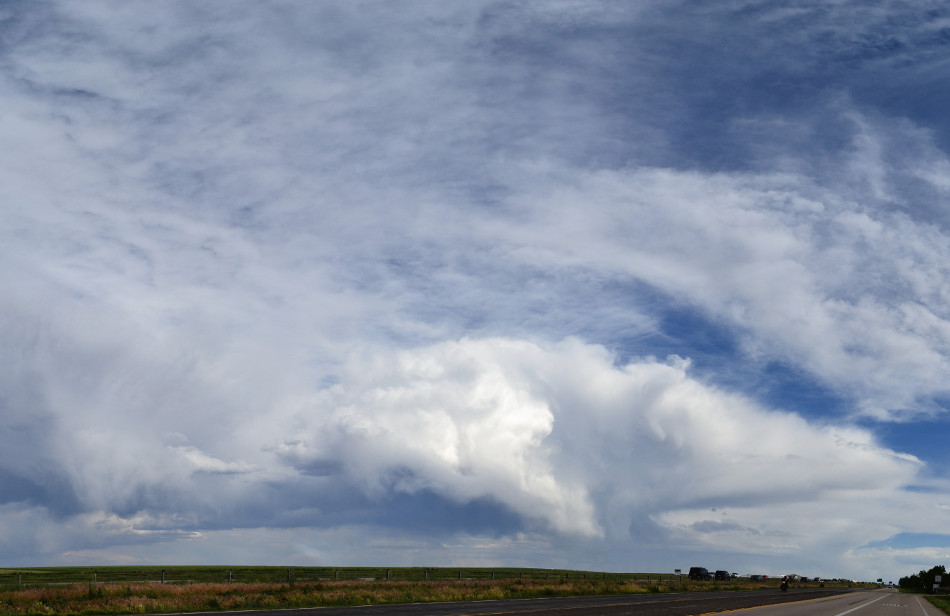 Distant Thunderstorm Painting the Sky with Wispy, Creamy Clouds